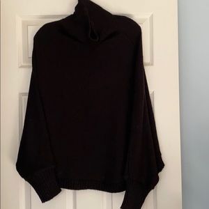 Black microfiber, slouched turtle neck sweater